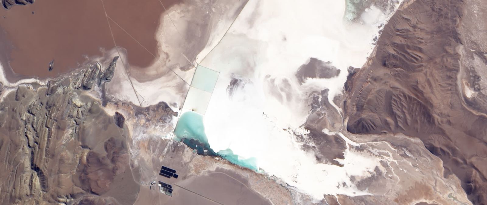 Aerial view of lithium brine evaporation ponds on the Salar del Hombre Muerto, Catamarca, Argentina